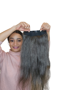 Model holding Salt and Pepper hair extension clip in hand – black and silver blend